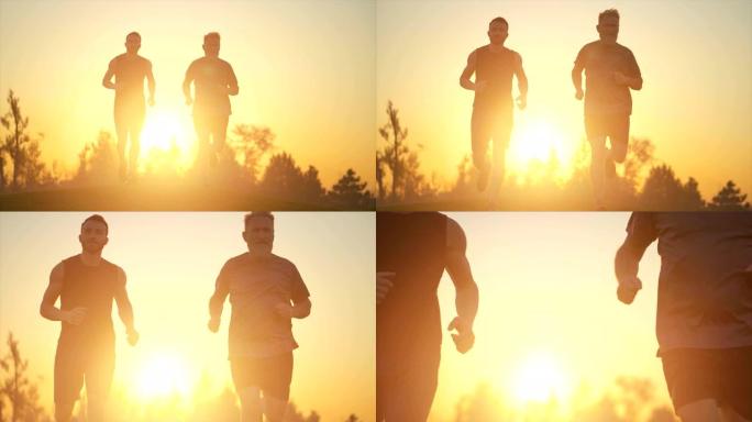 两个人在明亮的日落背景下在草地上奔跑。慢动作