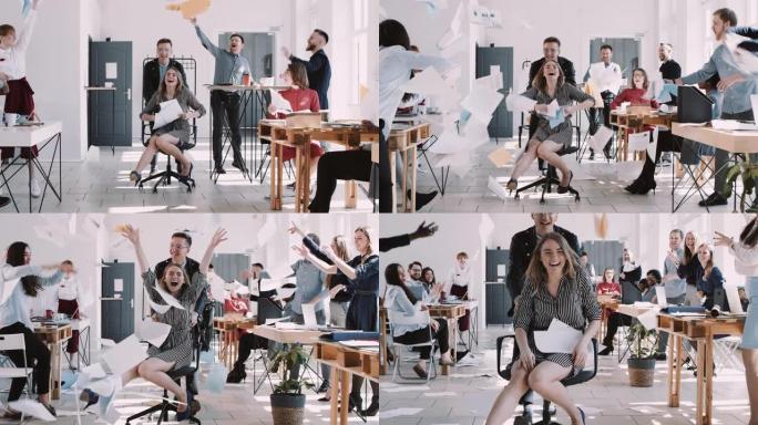 红色史诗-W 8К 快乐微笑的金发女商人玩得开心办公室同事扔纸在椅子上慢动作。
