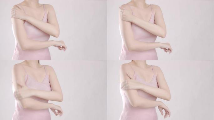 4k分辨率亚洲美女患肩部疼痛，成人使用手部按摩来恢复压力紧张。医疗保健和体育概念。