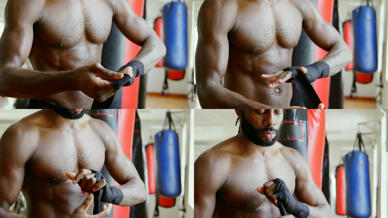 健身工作室4k的男性拳击手穿着手包