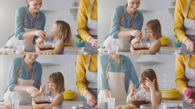 在厨房里: 一家四口一起煮松饼。母亲和女儿将面粉和水混合在一起，为纸杯蛋糕制作面团，父亲和儿子为平底