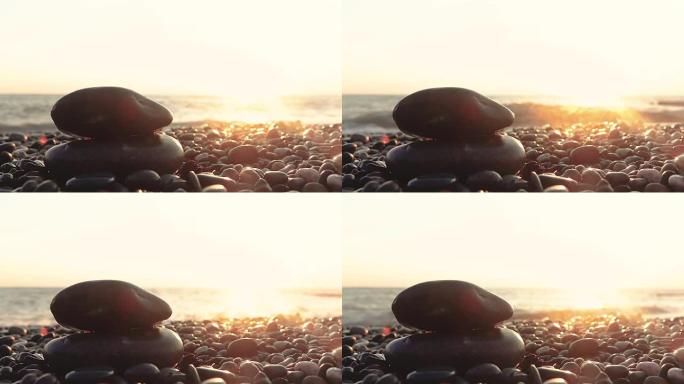 从岸边欣赏日落的美丽景色，前景是鹅卵石