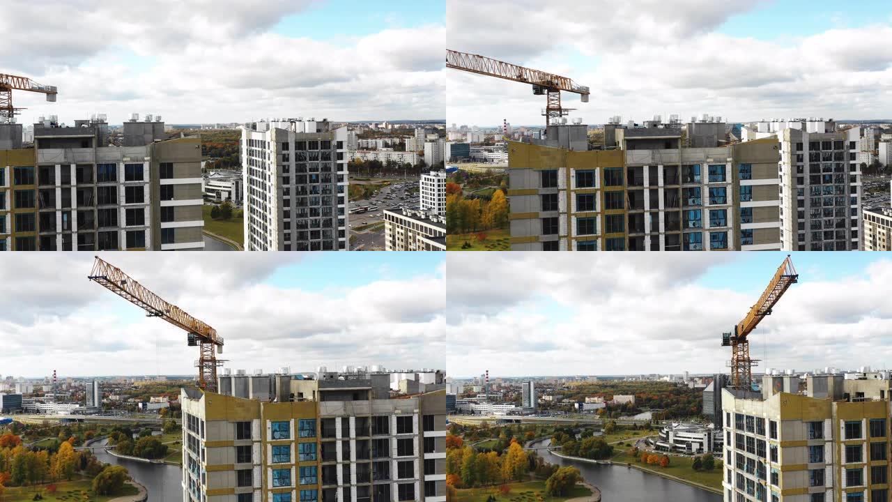 明斯克白俄罗斯国家图书馆地标附近正在建设的城市塔楼公寓楼的空中拍摄。