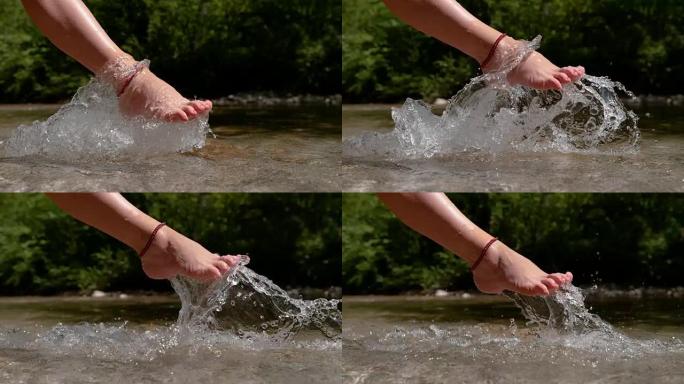 慢动作: 无法识别的脚踝手镯女人踢冻的水。