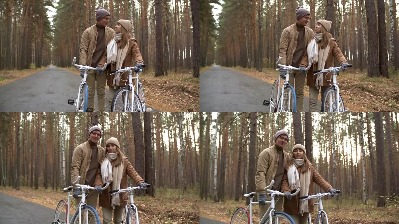 秋天公园里骑自行车的情侣肖像