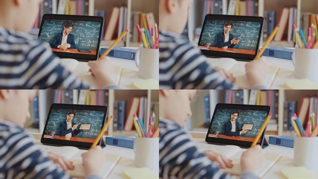 聪明的小男孩使用数字平板电脑与老师进行视频通话。屏幕显示在线讲座，老师从教室讲解主题。电子教育远程学