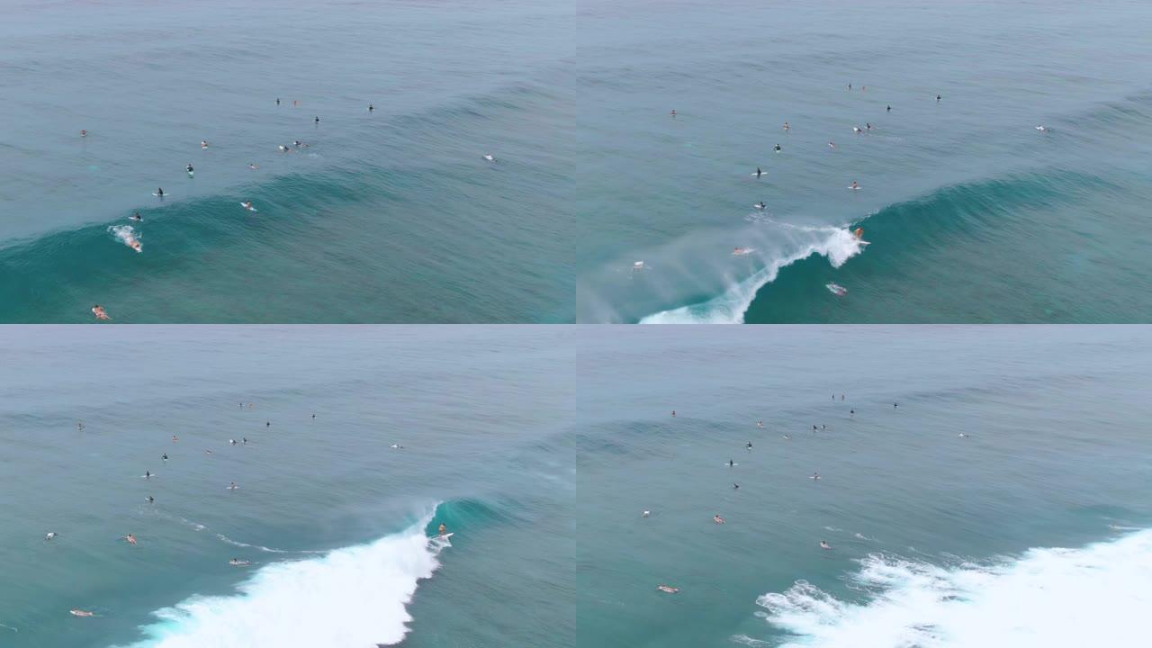 无人机: 当冲浪者等待捕捉来浪时，拥挤的队伍的风景镜头。