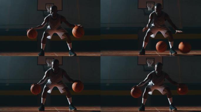 一名年轻的非洲职业男球员的电影慢动作镜头正在健身房用两个球练习篮球锻炼