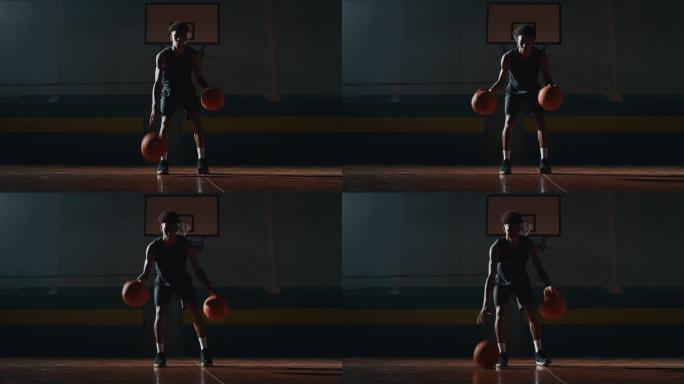 一名年轻职业男球员的电影慢动作镜头正在健身房用两个球练习篮球锻炼
