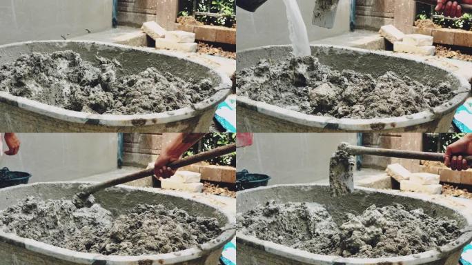 将水泥与水混合用于建筑施工的工人