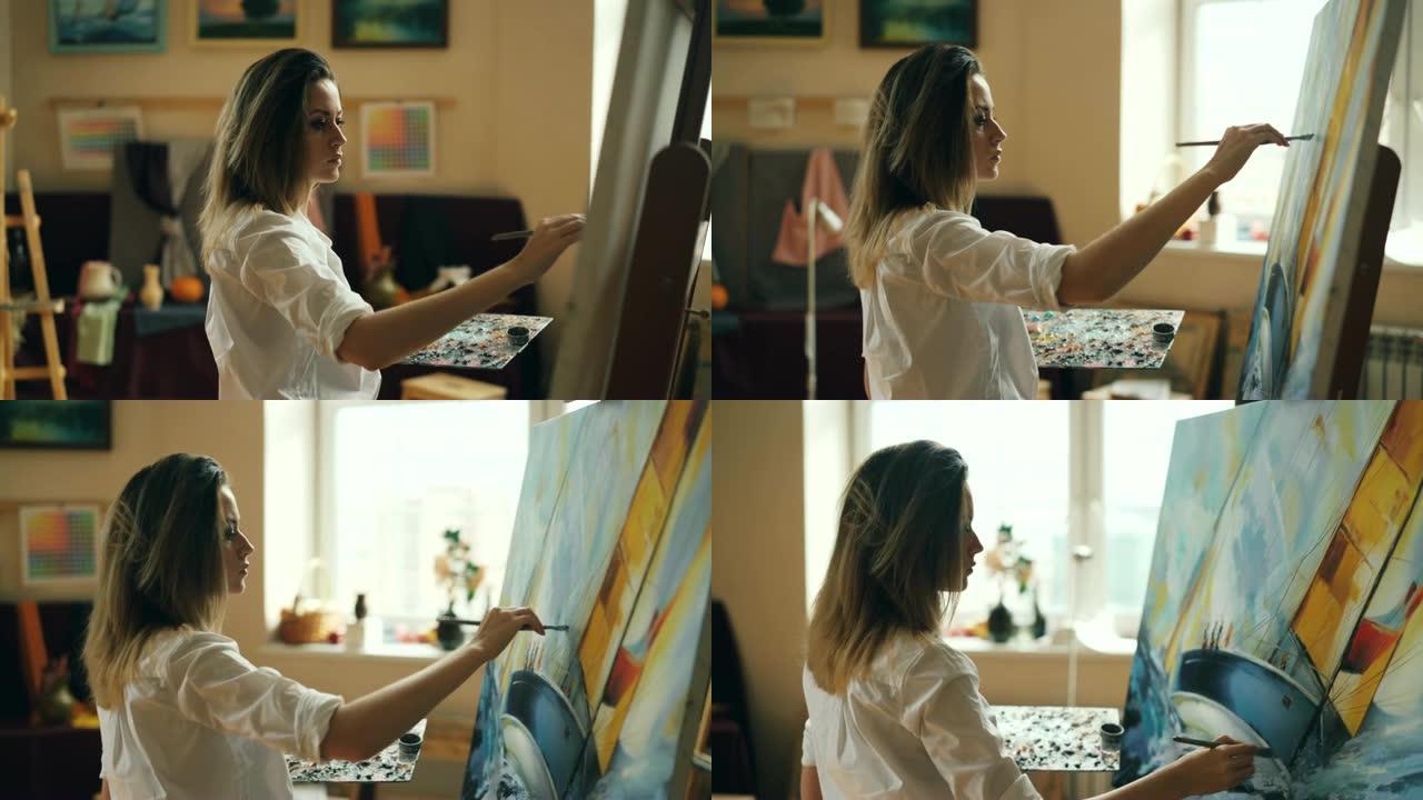 专业女艺术家正在工作室使用油画和画笔绘画海洋景观。美丽的女孩专注于她的创造性工作。