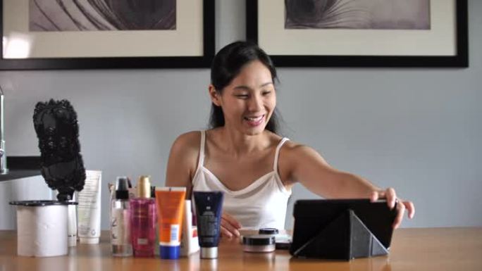 博客记录vlog视频与化妆化妆品在家在线影响者在社交媒体概念。直播病毒