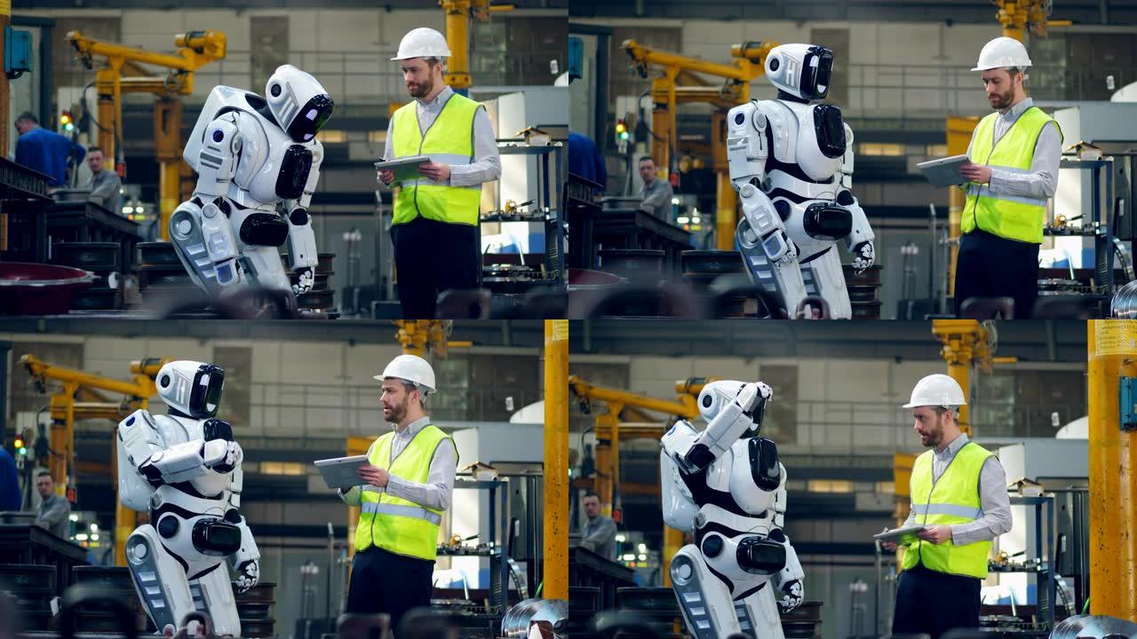 男性工人正在向机器人发出指示