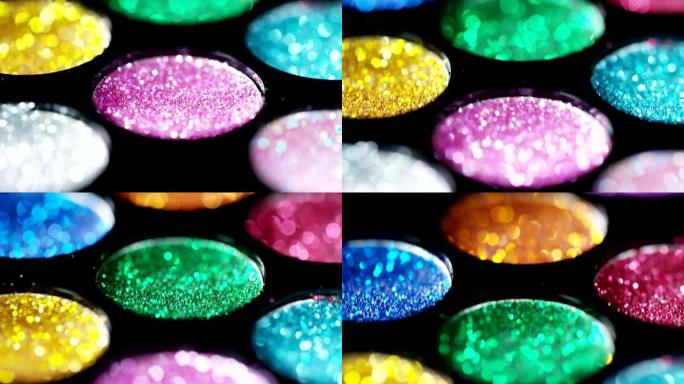 各种色调的明亮多彩的闪光的宏观拍摄，给美容技巧或伪装或指甲修指甲和护理带来一阵色彩。