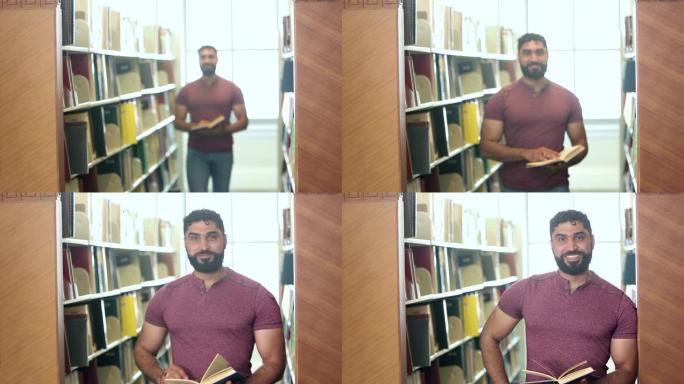 图书馆中的中东男子走向相机