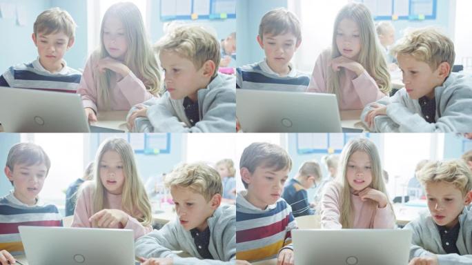 小学教室: 一群聪明的孩子使用笔记本电脑进行软件编程，交谈和团队合作。孩子们学习软件设计和创造性思维
