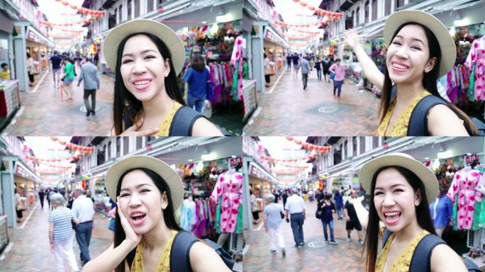 亚洲视频博客女性在新加坡中国城自拍。