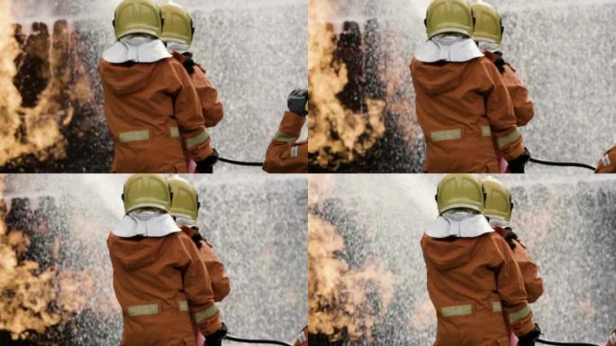 后视图: 亚洲消防员扑灭大火