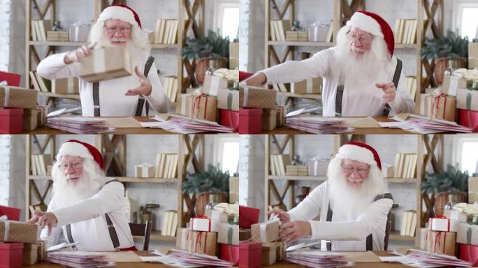圣诞老人在办公桌前整理圣诞礼物