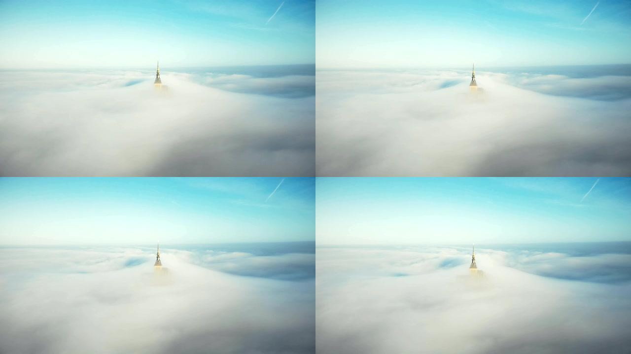 在诺曼底日出时，无人驾驶飞机在圣米歇尔山城堡尖顶上方被空灵的大气雾雾覆盖。