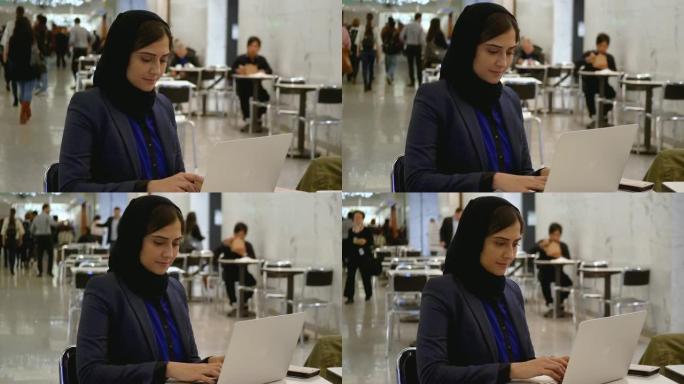 穆斯林妇女使用笔记本电脑