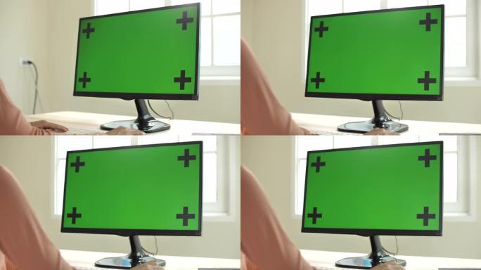 女人使用绿屏电脑加号绿色操作