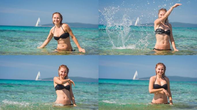 顽皮的女人在阳光明媚的夏日以慢动作将海水溅向相机