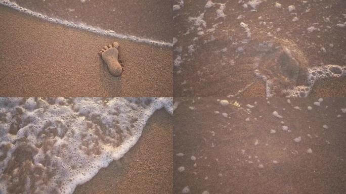 波浪冲走沙子制成的脚印
