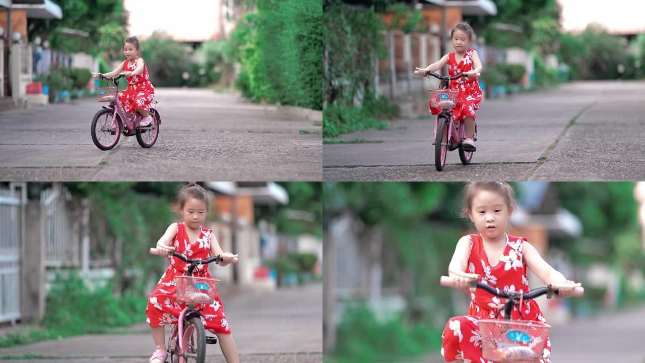 亚洲小女孩学骑自行车