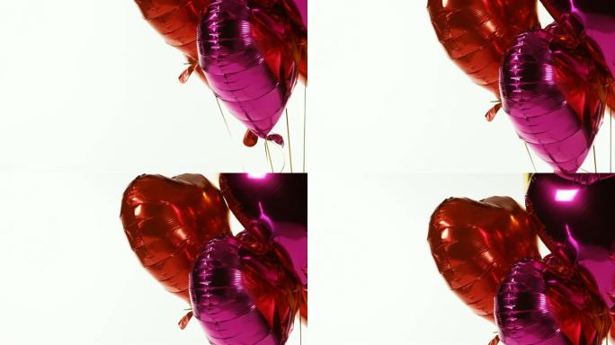 红色和紫色气球漂浮在空中4k
