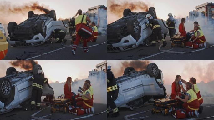 车祸交通事故: 医护人员和消防员营救受伤的被困受害者。医护人员对一名女乘客进行急救。消防员使用液压切