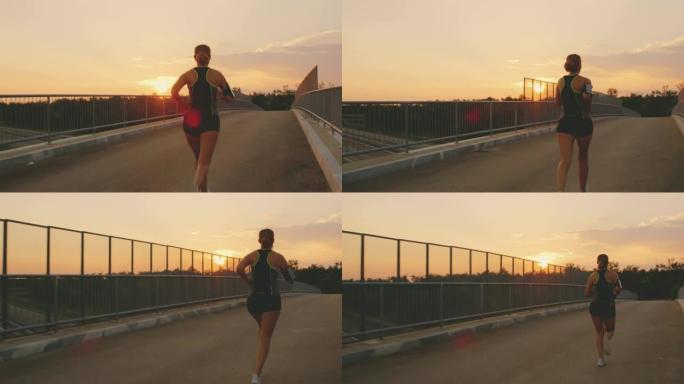 日落时分，SLO MO女人在桥上奔跑