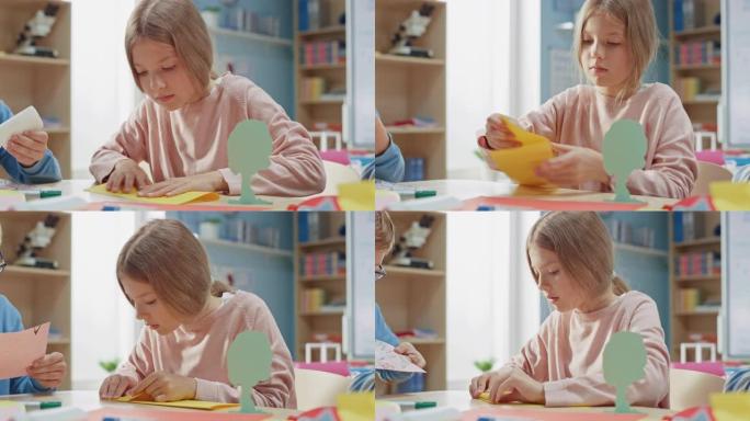 小学工艺美术班: 可爱的金发小女孩在手工艺项目上和同学玩得很开心，用彩纸折叠漂亮的折纸