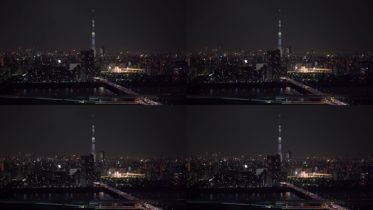 东京天空树的4k镜头场景定位于各种建筑的城市景观和交通路口，在夜间高峰时间，日本，城市景观和交通概念