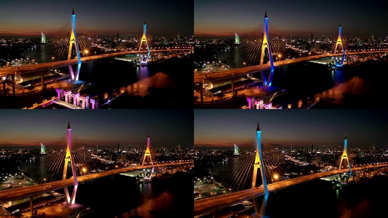 夜间两次穿越湄南河的普密蓬大桥工业环桥鸟瞰图