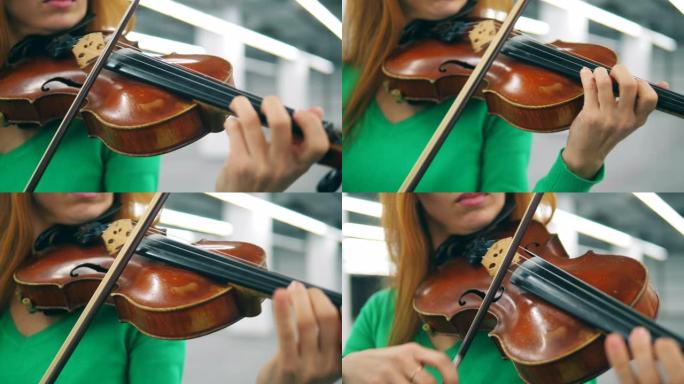 女音乐家手中的小提琴和弓
