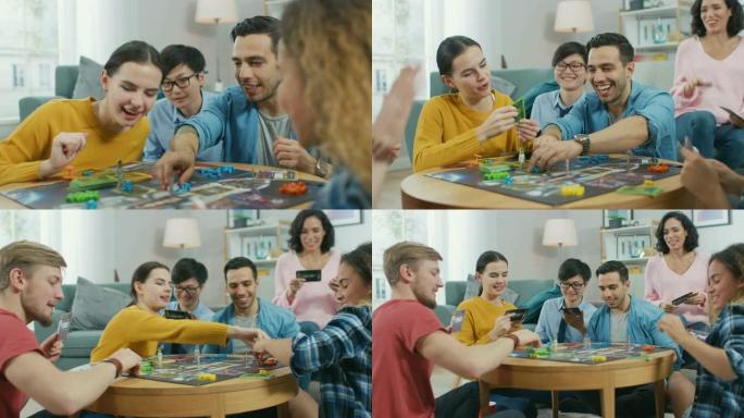 各种各样的男孩和女孩在用纸牌和骰子玩战略棋盘游戏。团队成员击掌。白天舒适的客厅