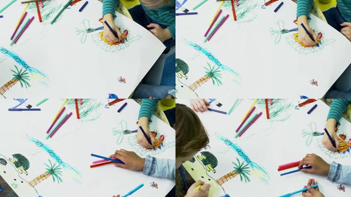 小孩子的手在纸上画画