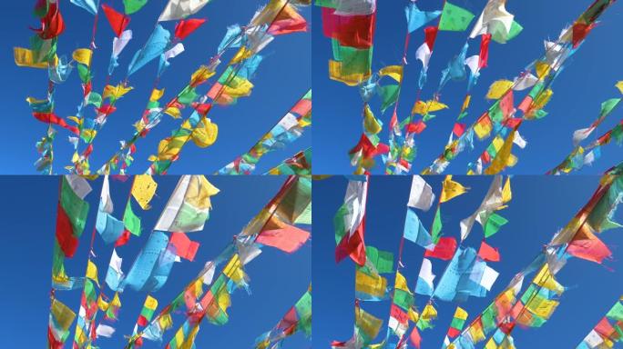 自下而上: 在吹过西藏的风中，悬挂在绳索上的彩旗