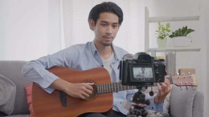 亚洲男子在线教吉他