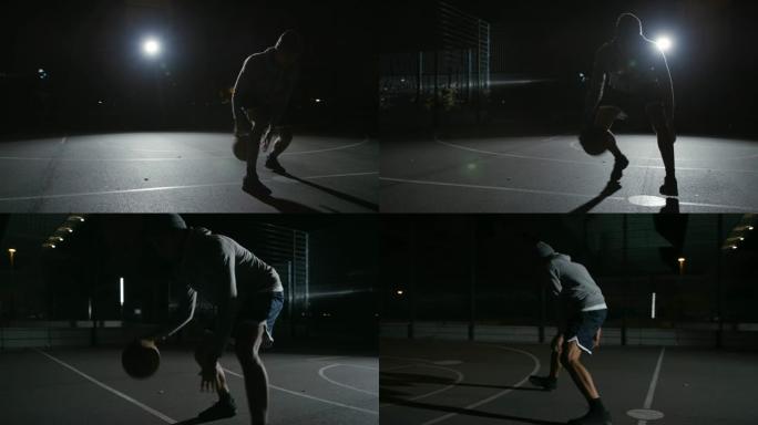 活跃的运动员在夜间运球篮球