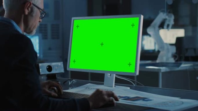 专业重工业工程师在绿色模拟屏幕计算机上工作。拥有各种机器人、建筑和机械部件的工程局和工业设计机构