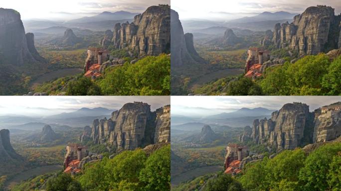 东正教基督教修道院位于希腊色萨利平原的陨石岩层上。Pindus山脉位于背景中。平移镜头，4K