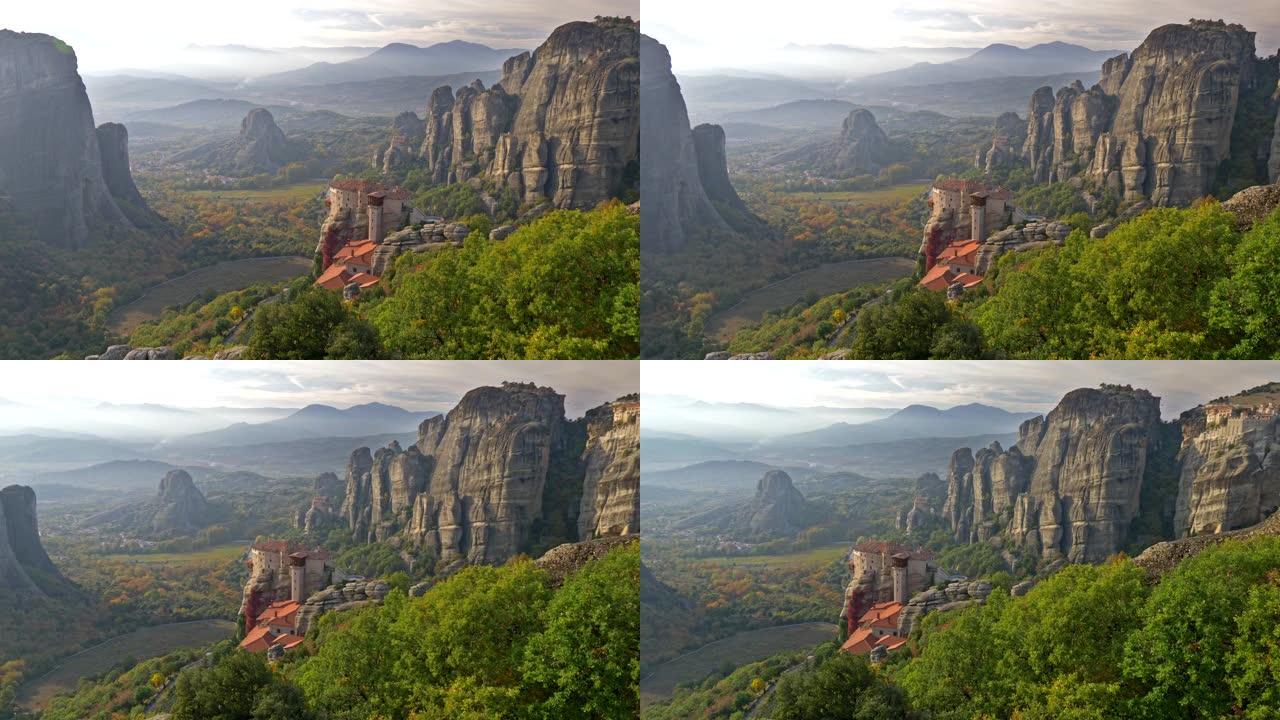 东正教基督教修道院位于希腊色萨利平原的陨石岩层上。Pindus山脉位于背景中。平移镜头，4K