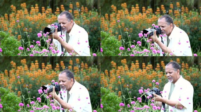 拍摄鲜花的非裔美国高级男子