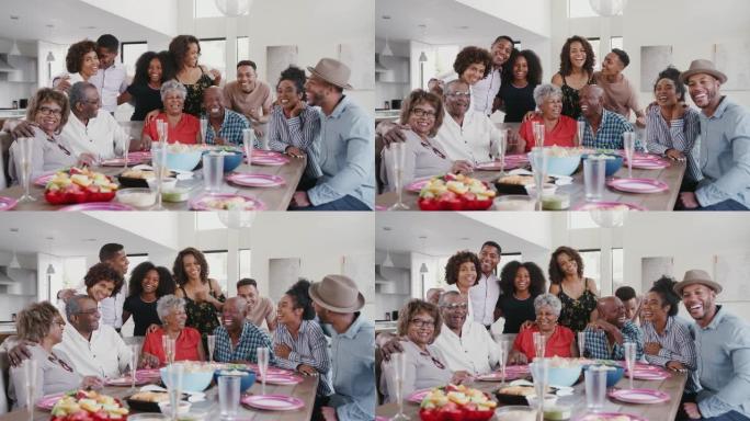 大型三代黑人家庭集体肖像在家里的庆祝活动中在餐桌上
