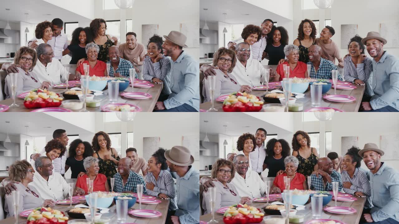大型三代黑人家庭集体肖像在家里的庆祝活动中在餐桌上