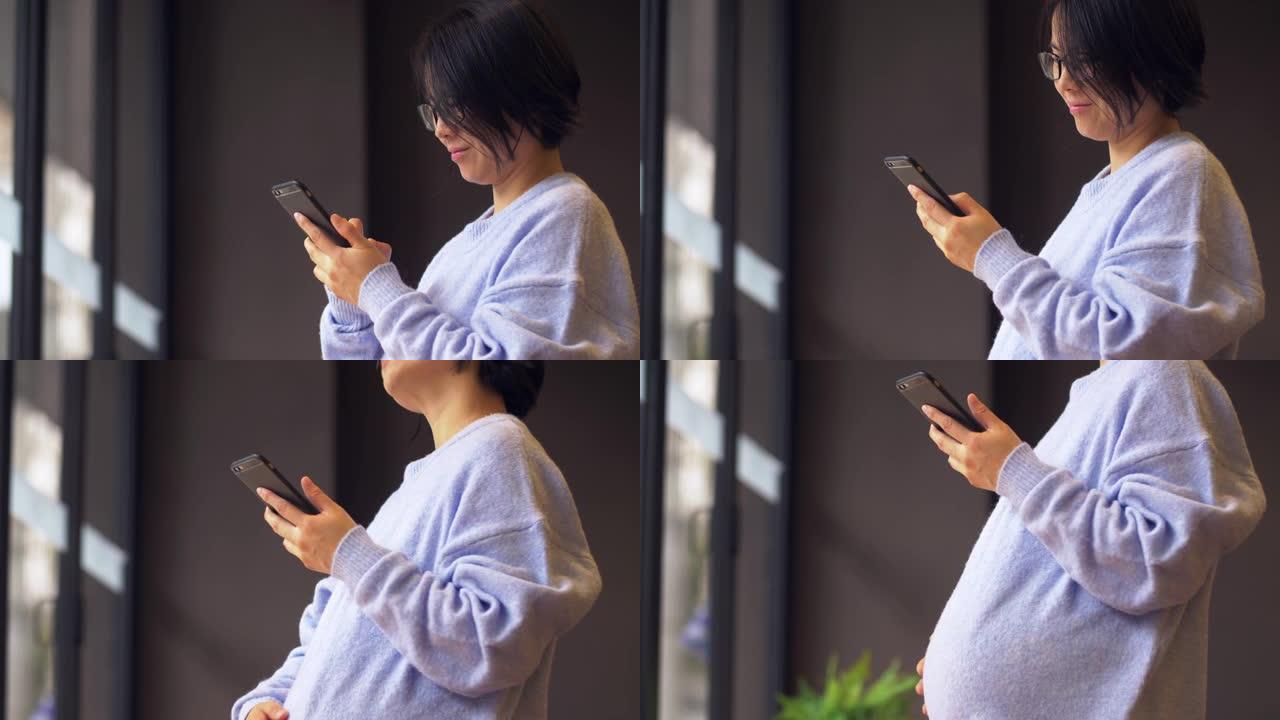 中国孕妇站着使用手机