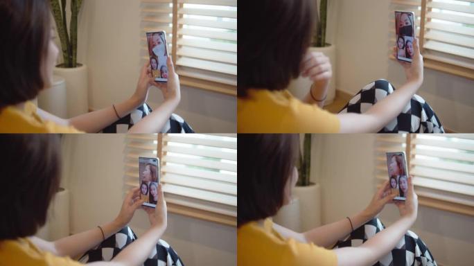 亚洲妇女使用电话，亚洲女孩通过在家中通过视频通话与朋友聊天