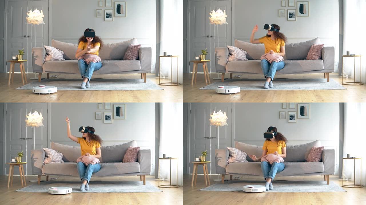 机器人胡佛正在和一个戴着VR眼镜的女孩打扫房间